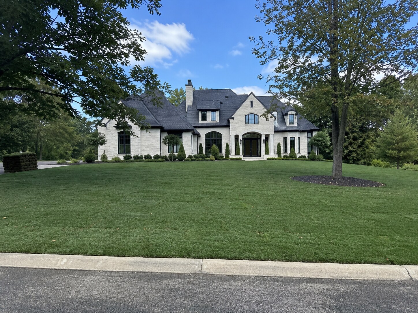 Finished residential lawn with a clean edge and healthy sod